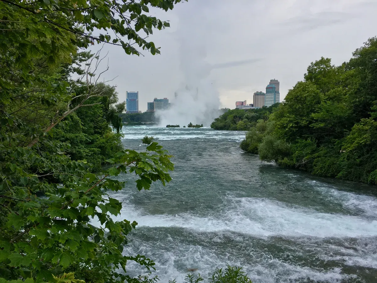The rapids of the Niagara River seen from the Three Sisters Islands on a Niagara Falls tour from NYC, New York